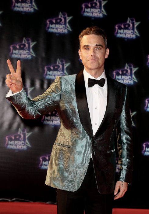 Robbie Williams : un passionné au "bon niveau" Robbie Williams : un passionné au "bon niveau"