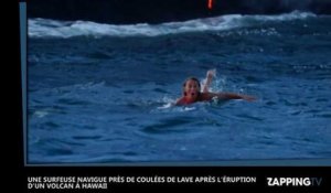 Elle fait du surf près de coulées de lave d'un volcan en éruption à Hawaii