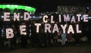 Night time climate protest on banks of River Clyde