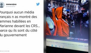 Drôle de face-à-face sur les Champs-Élysées entre forces de l'ordre et Marianne aux seins nus