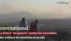 International: La Grèce "en guerre" contre les incendies, des milliers de touristes évacués