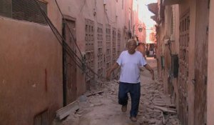 People walk amid rubble in the Jewish quarter of quake hit Marrakesh