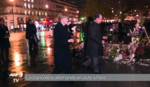 A Paris, Merkel promet d'agir "vite" contre le terrorisme