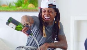 Lil Wayne pours champagne on his new phone!