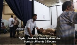 Attention, les images peuvent choquer: Syrie: des blessés dans des bombardements à Douma (ONG)