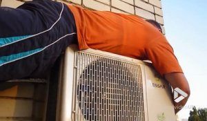 Suspendu dans le vide au 7ème étage pour réparer la clim de l'appartement !!