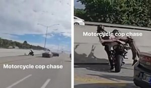 Un policier plaque un motard sur l'autoroute
