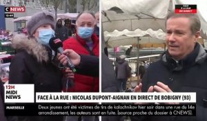 Face à la rue - Nicolas Dupont-Aignan interpellé sur le marché de Bobigny par une habitante: "La seule chose que vous voulez c'est la place" - VIDEO