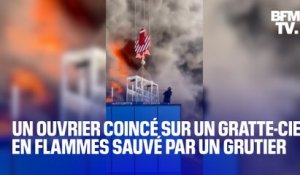 Coincé tout en haut d'un gratte-ciel en flammes en Angleterre, un ouvrier est sauvé par un grutier