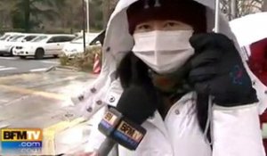 Japon : masques et parapluies pour se prot&#xE9;ger
