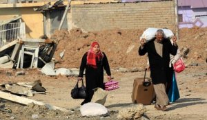 Mossoul : leur quartier repris, ils fuient par craintes de représailles