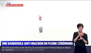 "L'économie nous coûte la vie": une banderole anti-Macron en peine cérémonie du 14-Juillet