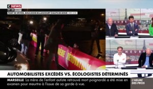 Découvrez les images des vives tensions entre des automobilistes et des militants écologistes qui bloquent la circulation sur le pont de Sèvres à Boulogne-Billancourt