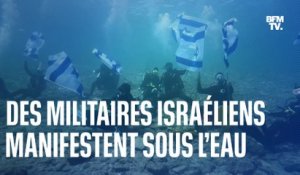 Des militaires israéliens manifestent sous l’eau contre la réforme de la justice